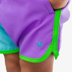 RUGGEDBUTTS Boys UPF50+ Sun Protected Stretch Dolphin Hem Swim Trunks - Neon Bright Aqua Color Block, 3-6m