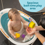 The First Years Sure Comfort Collapsible Baby Bathtub - 2-Position Grow with Me Design - Lightweight and Portable Travel Bathtub for Baby - Ages 0 to 18 Months