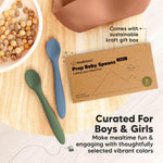 Two baby spoons on a wooden surface with a Kecababies packaging box.