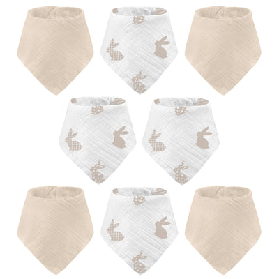 Set of baby bibs with beige and white patterns on a white background