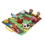 Farm-themed play mat with plush toys on a white background