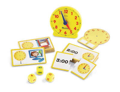 Educational clock set with cards and dice on a white background
