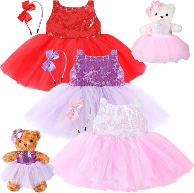 Set of children's dresses in red, purple, and pink with matching teddy bears on a white background.
