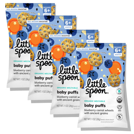 Multiple packages of Little Spoon baby puffs on a white background