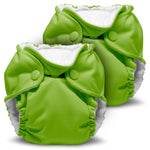 Two green baby diapers with white interiors on a white background