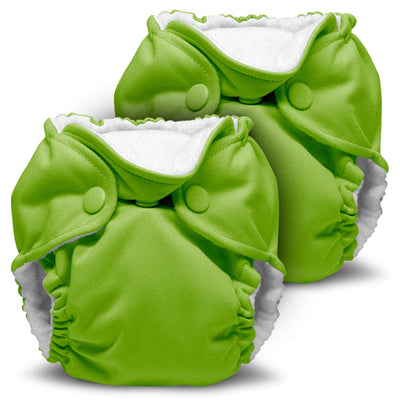 Two green baby diapers with white interiors on a white background
