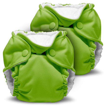 Two green baby diapers with white interiors on a white background
