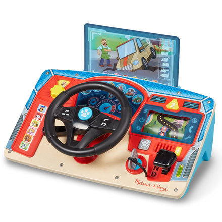 Children's toy steering wheel and dashboard set with screen displaying educational content, brand 'Melissa & Doug' visible.