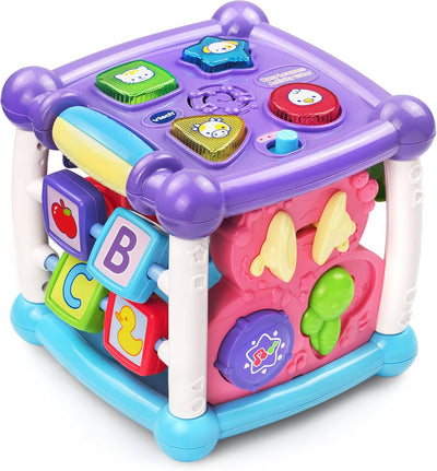 Colorful children's toy cube with various educational elements on a white background