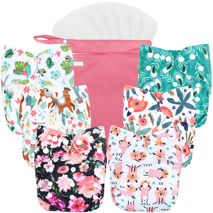 Set of colorful patterned baby diapers with a pink bag on a white background