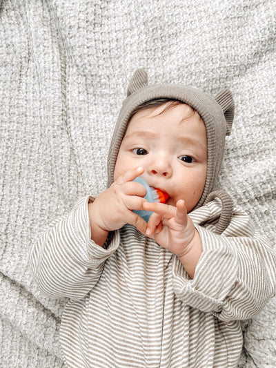 Itzy Ritzy Silicone Teensy Teether – Flexible, Soft & Hollow Baby Teething Toy with Easy-to-Hold Handle – Designed for Ages 3 Months and Up (Hero Pop)