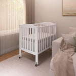 Dream On Me 2-in-1 Folding Portable Compact Mini Baby Crib in White, GreenGuard Gold & BSA, US Patented Flat Folding System, Locking Wheels,1″ Mattress Pad, Space-Saving Quck Fold Easy Storage