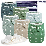 Set of cloth diapers with button closures on a white background