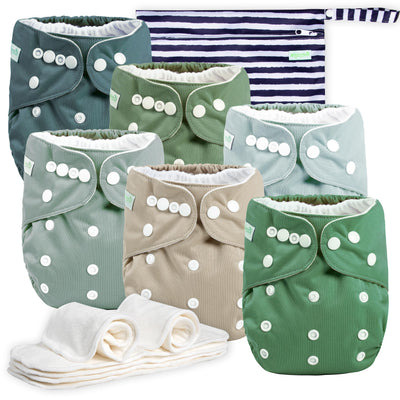 Set of cloth diapers with button closures on a white background