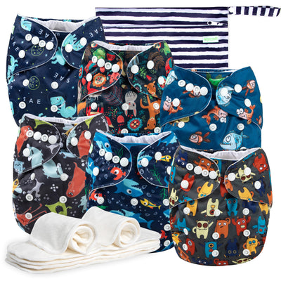Collection of colorful baby diapers with animal patterns on a white background