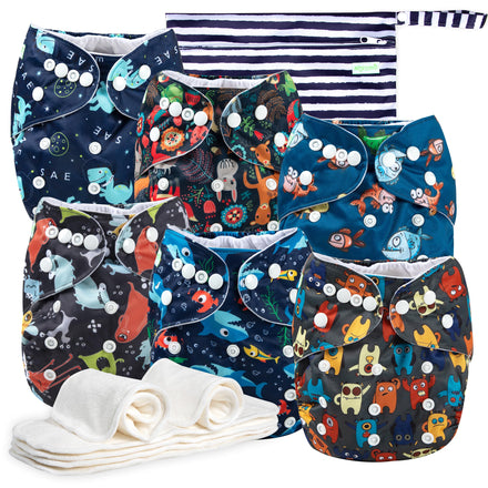 Collection of colorful baby diapers with animal patterns on a white background