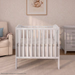 Dream On Me 2-in-1 Folding Portable Compact Mini Baby Crib in White, GreenGuard Gold & BSA, US Patented Flat Folding System, Locking Wheels,1″ Mattress Pad, Space-Saving Quck Fold Easy Storage