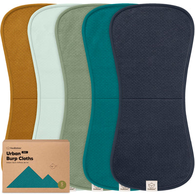 Set of five burp cloths in different colors with a cardboard packaging box labeled 'Urban Burp Cloths'.